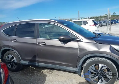 2016 Honda Cr-V Touring z USA, uszkodzony, nr VIN 5J6RM3H97GL004260